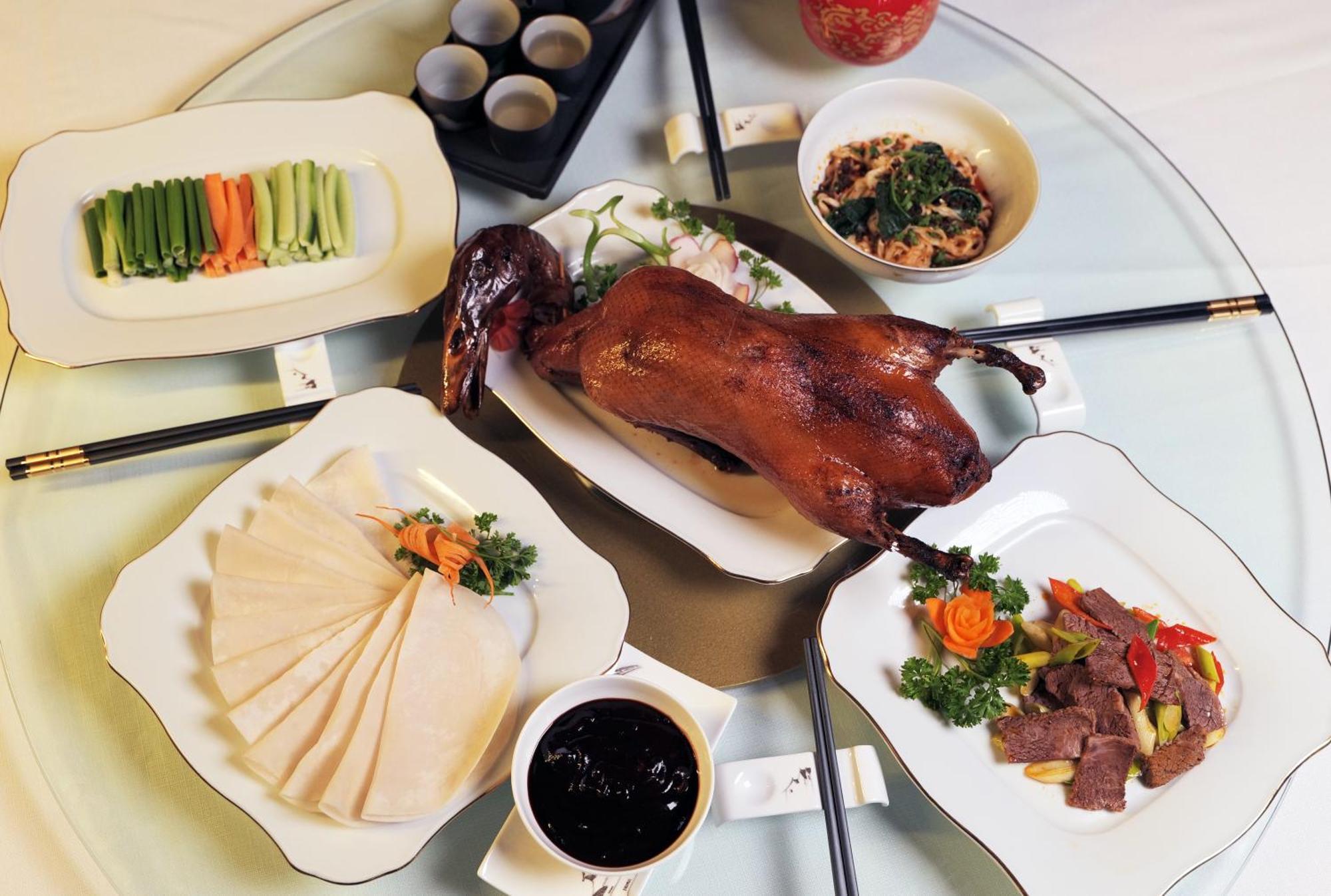 Beijing Palace Soluxe Hotel Astana Buitenkant foto A selection of dishes prepared with duck